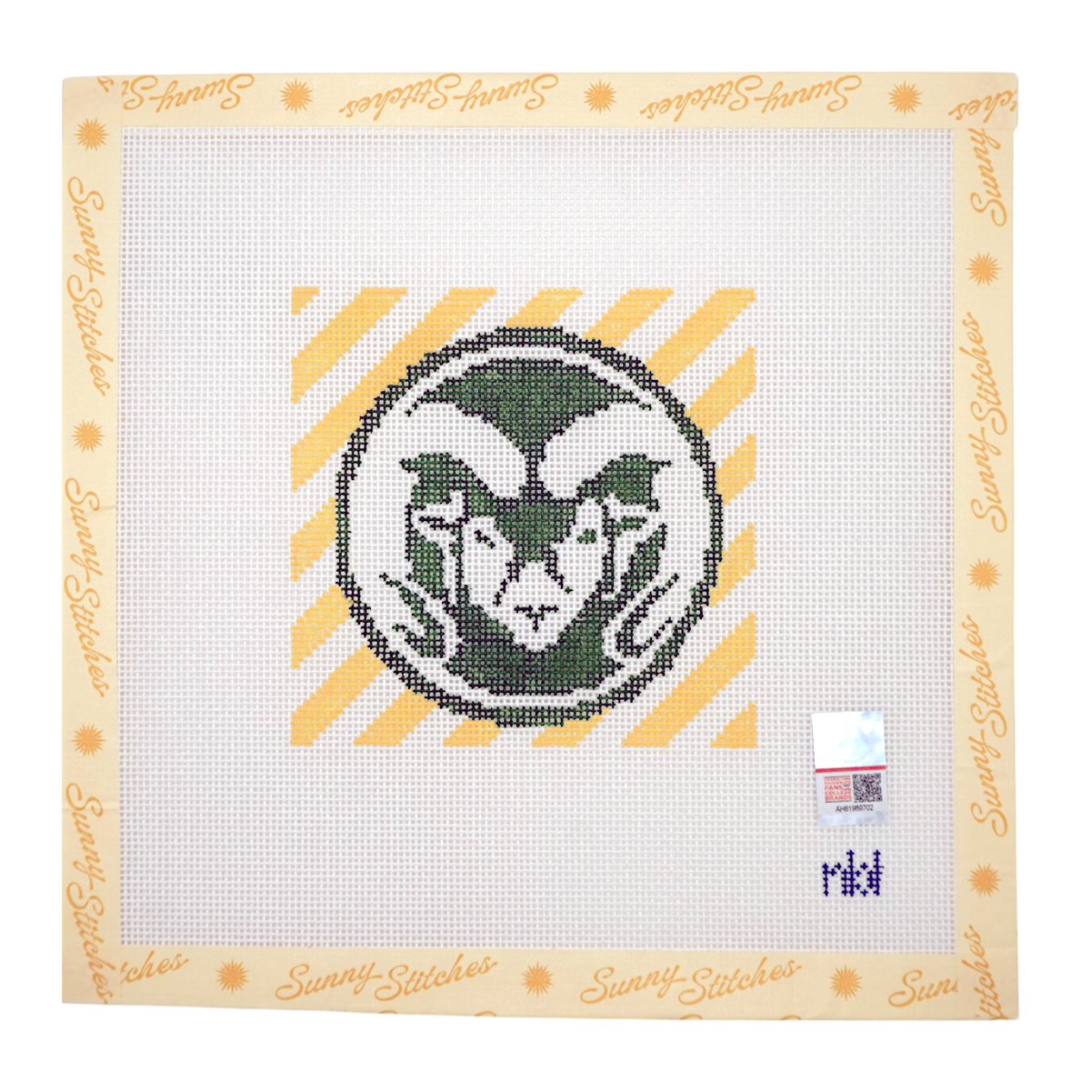 A completed needlepoint canvas featuring the Colorado State University logo, with a cream border printed with 'Sunny Stitches' branding. The design includes a green and white ram head inside a circle on a yellow and white striped background.