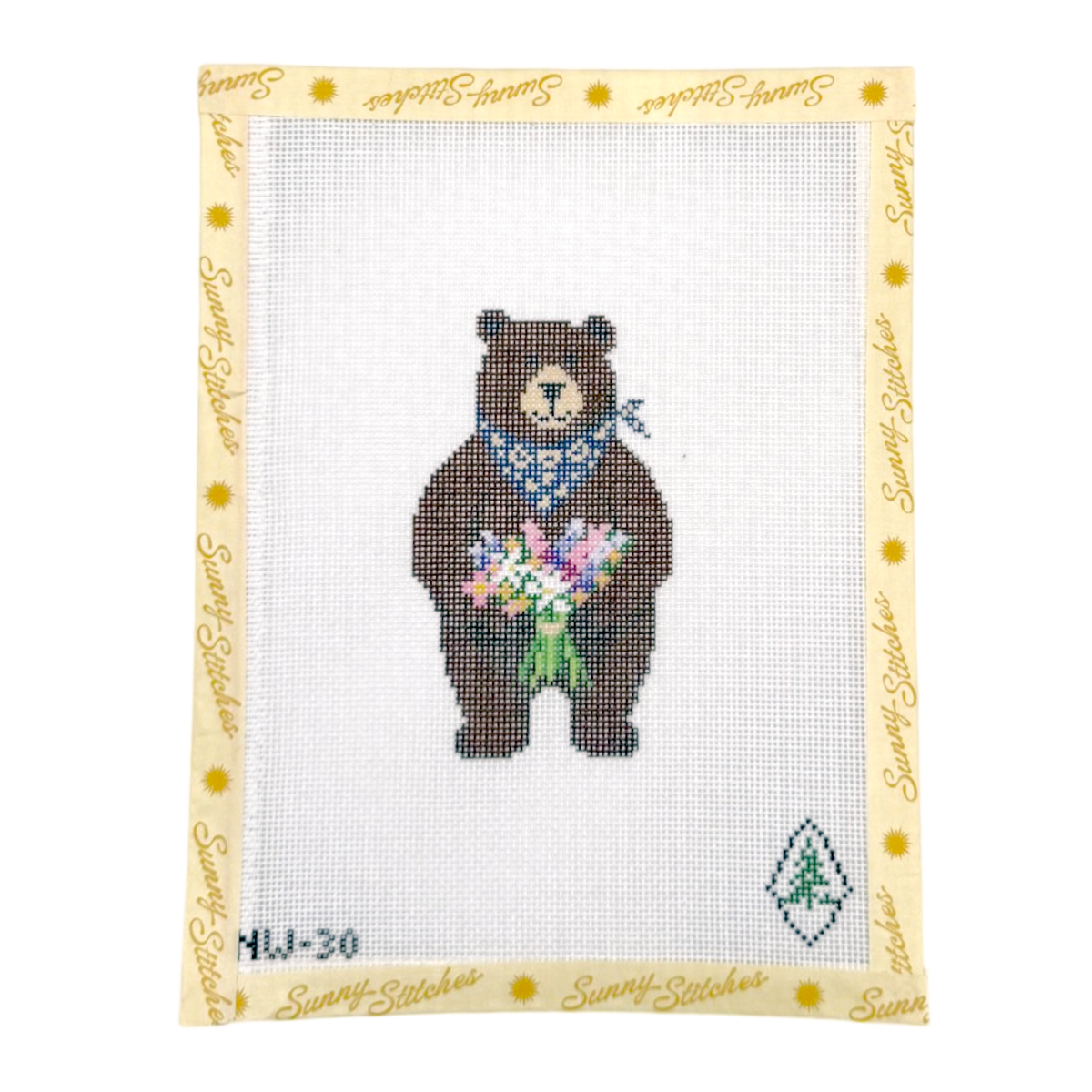 A needlepoint canvas featuring a brown bear holding a colorful bouquet of flowers, wearing a blue patterned bandana. The canvas is framed by a light yellow border printed with 'Sunny Stitches' in gold script and small yellow sun icons.