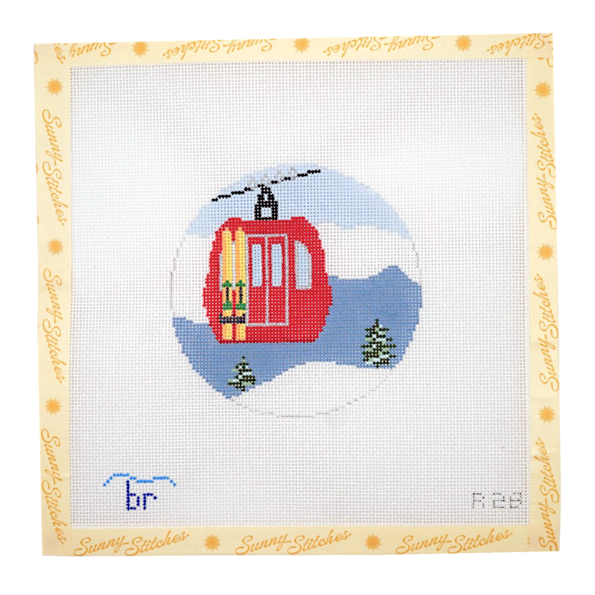 A square needlepoint canvas featuring a red cable car / gondola with yellow skis, set against a snowy blue mountain background. The canvas is framed by a light beige border printed with the brand name 'Sunni Stitches' in gold script.