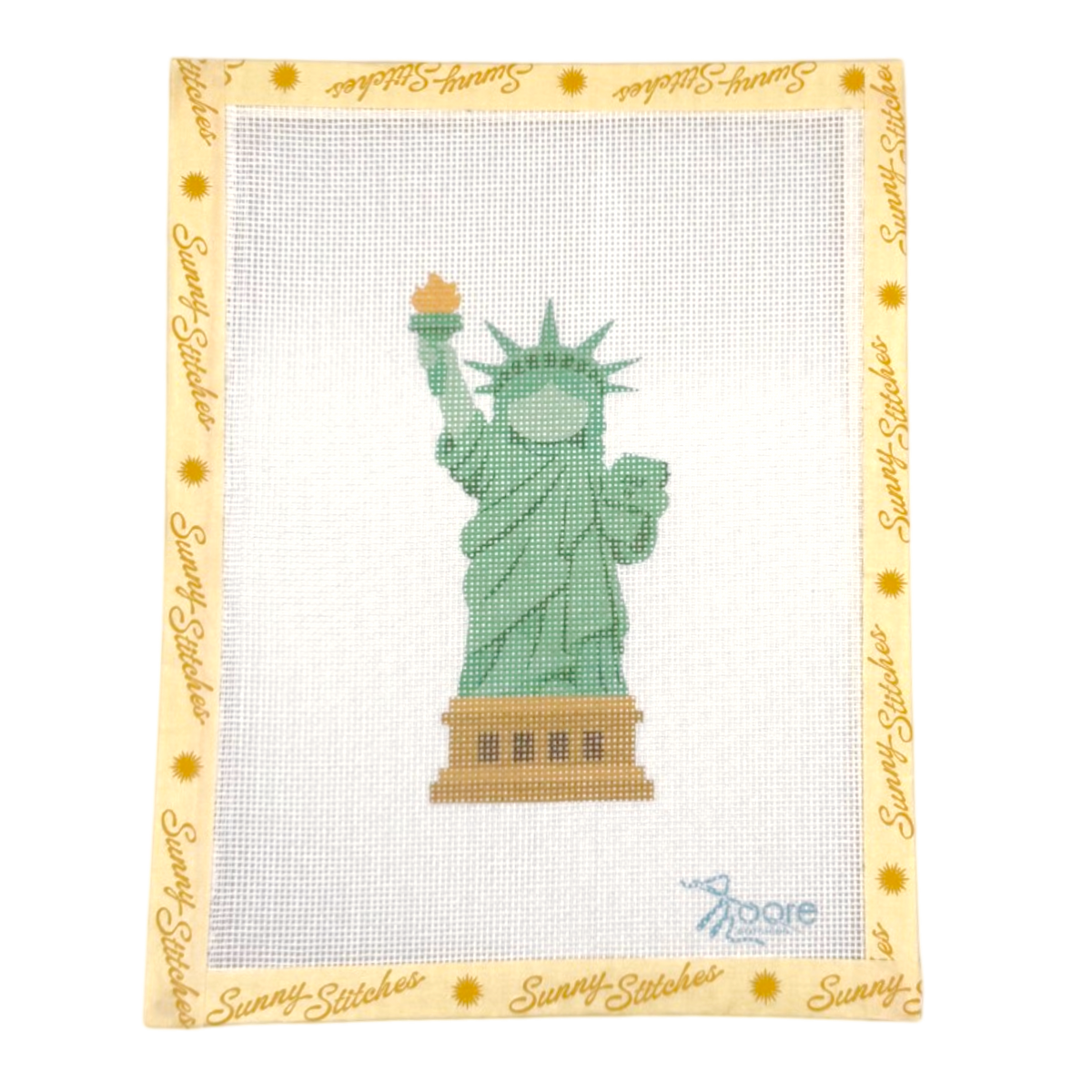 A square needlepoint canvas featuring a green Statue of Liberty design in the center, surrounded by a cream border printed with the brand name 'Sunny Stitches' and small yellow sun motifs. The canvas is photographed flat against a clean white background.