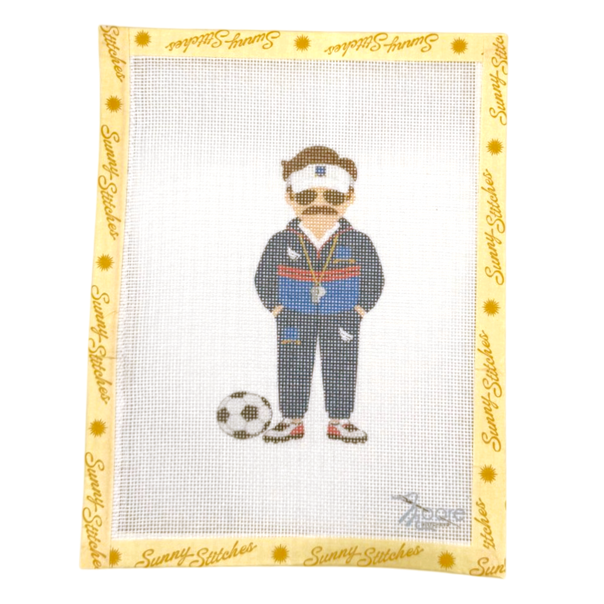 A square canvas needlepoint design featuring a cartoon-style Ted Lasso in a navy tracksuit with red and blue stripes, sunglasses, and a mustache, standing next to a soccer ball. The canvas has a yellow border printed with the brand name 'Sunny Stitches'.